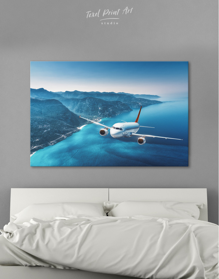 Aeroplane Flying Over Islands Scene Canvas Wall Art
